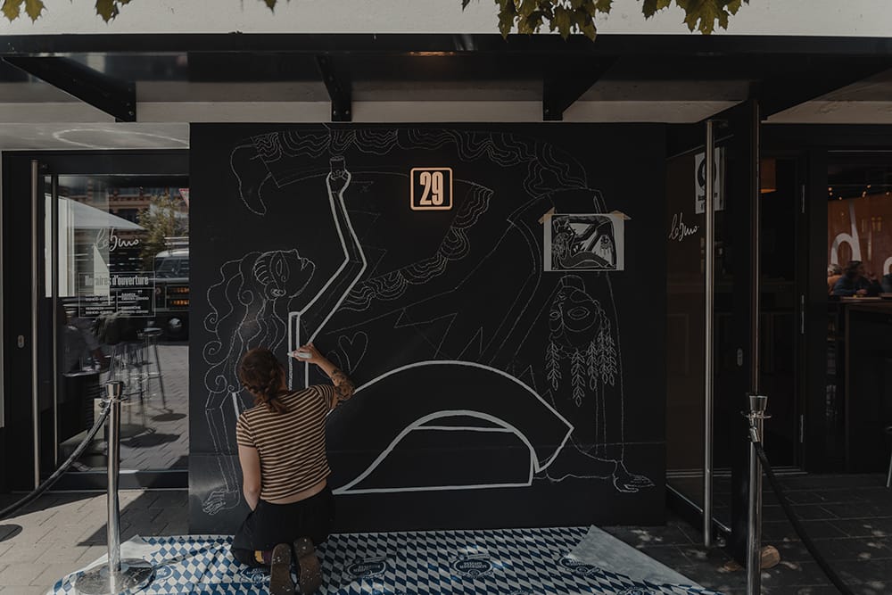 Painting the wall of "Le Buro" bar in Bulle, Switzerland.