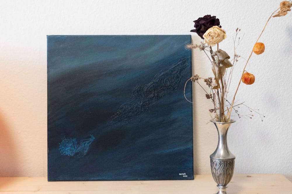 Painting named "Empty space", representing a person floating in the blue background.