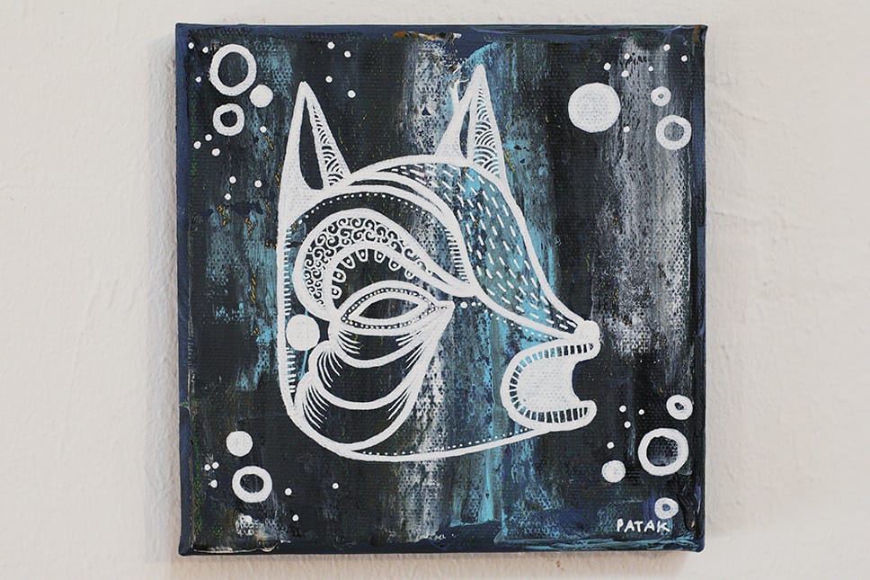 Painting representing a mask and bubbles, on a blue and black background.